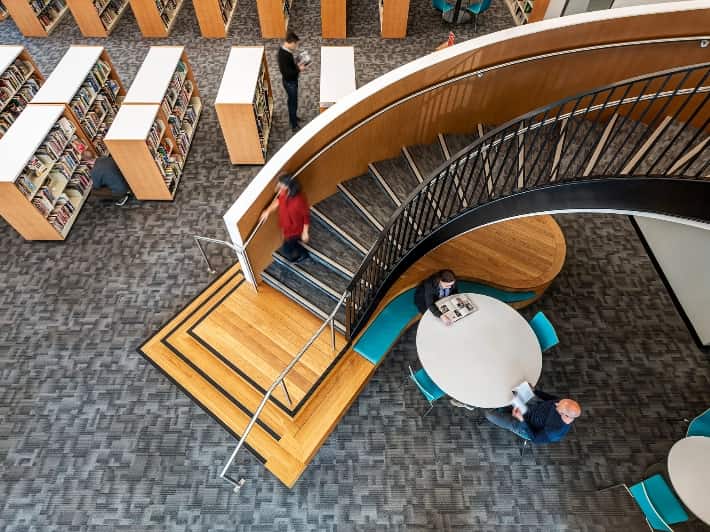 An aerial view of the library interior with the stairs as a focal point